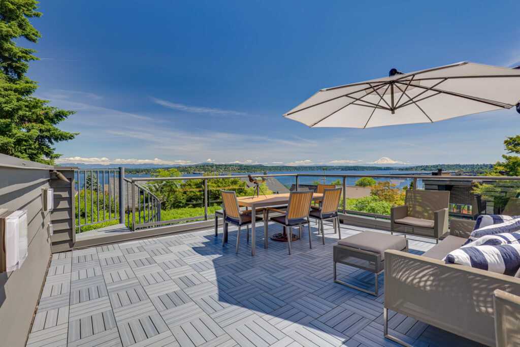 Spacious deck with lake view and Mount Rainier backdrop