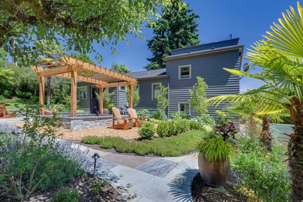 Lush garden with pergola and modern house