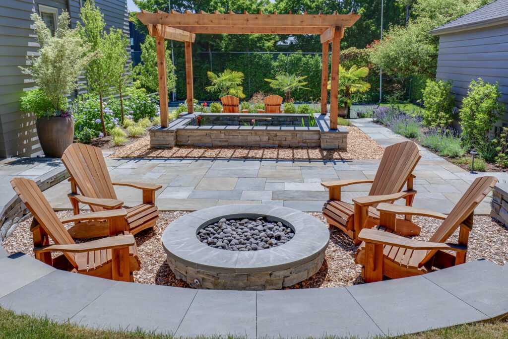 Inviting backyard with fire pit, Adirondack chairs, and pergola