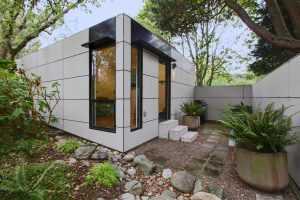 Modern small house with garden and stone pathway
