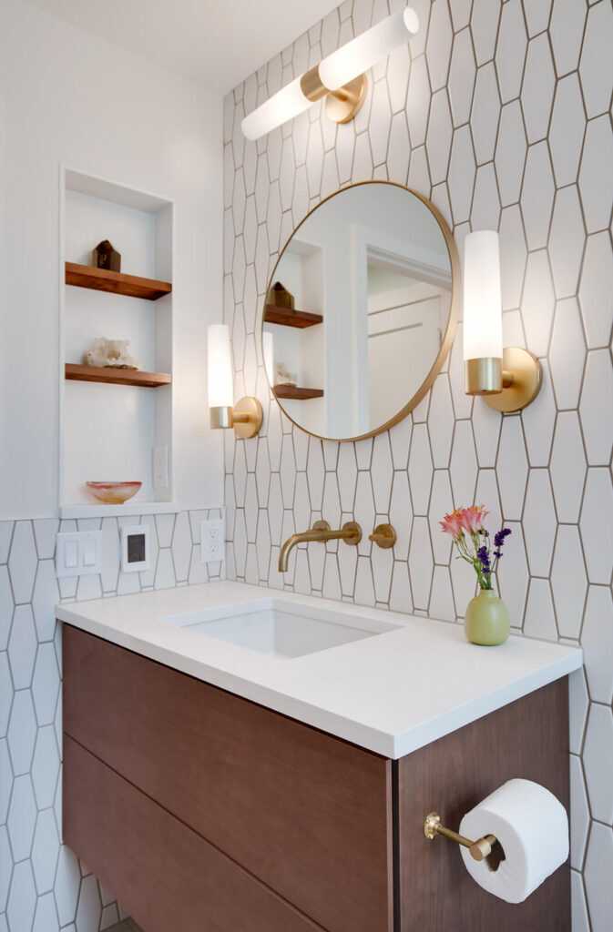 Modern bathroom with geometric tile and gold fixtures