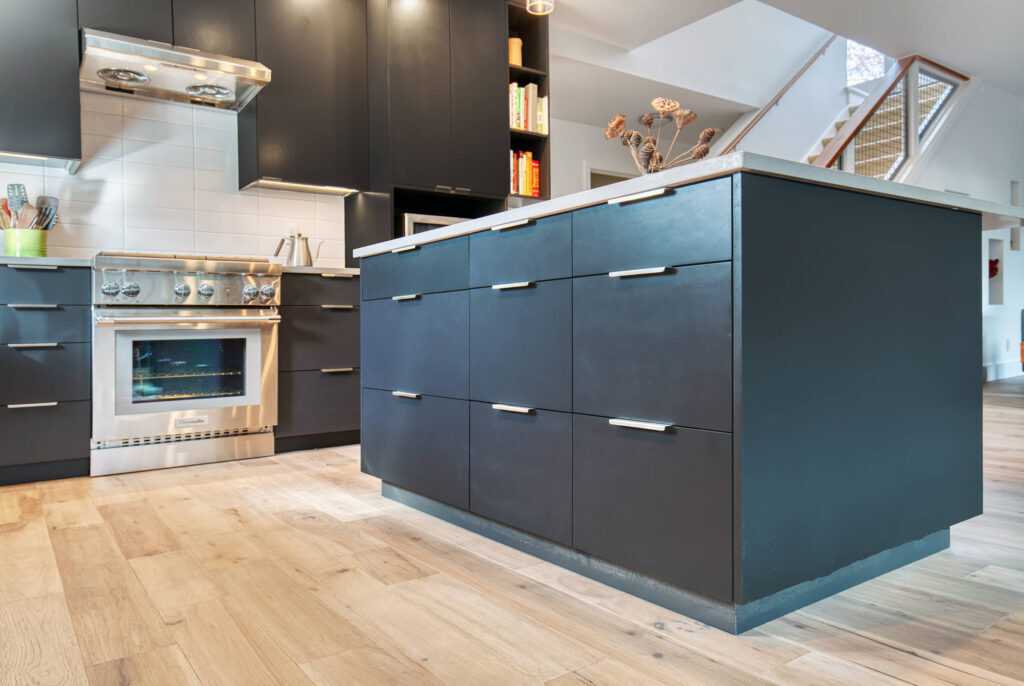 Modern kitchen with stainless steel appliances and dark cabinetry
