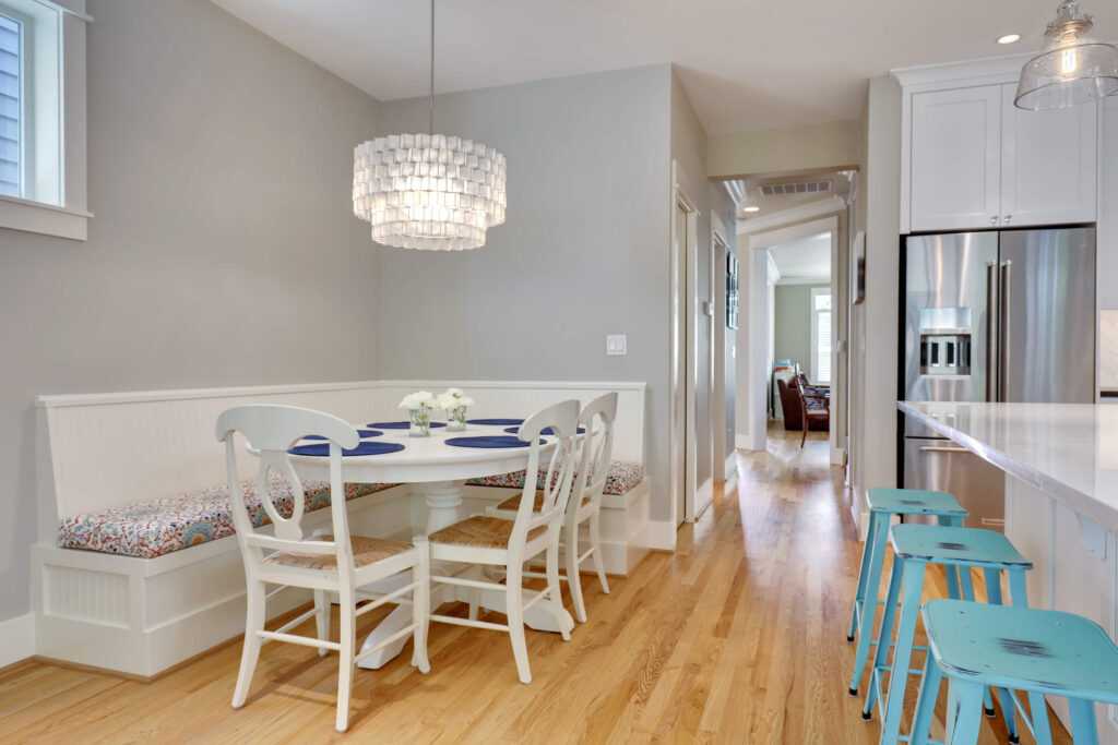 Modern kitchen with dining area and stylish lighting