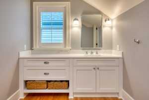 Modern bathroom with marble countertop and window