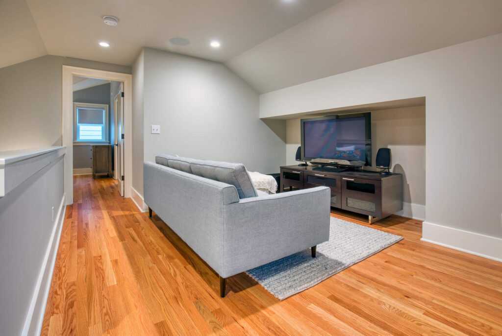 Modern living room with sleek furniture and hardwood floors