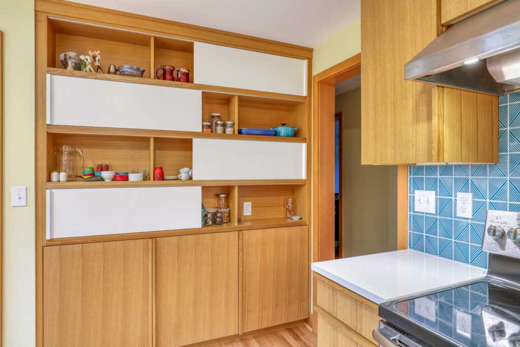 Modern kitchen with wooden cabinets and blue tile backsplash