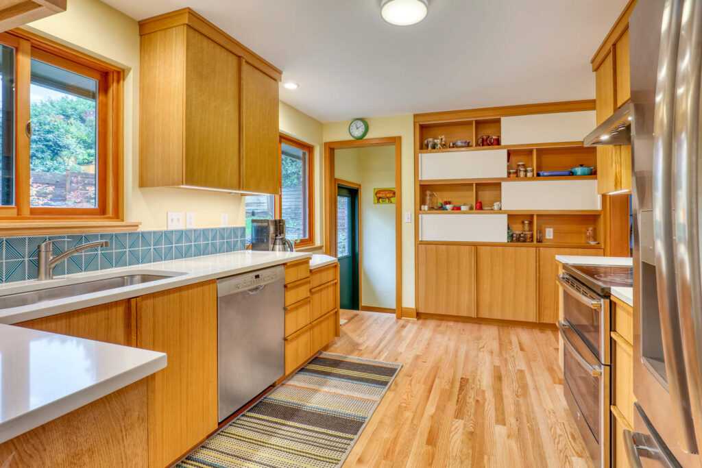 Spacious modern kitchen with wooden cabinets and appliances