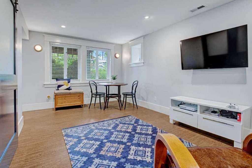 Bright modern living room with furniture and television