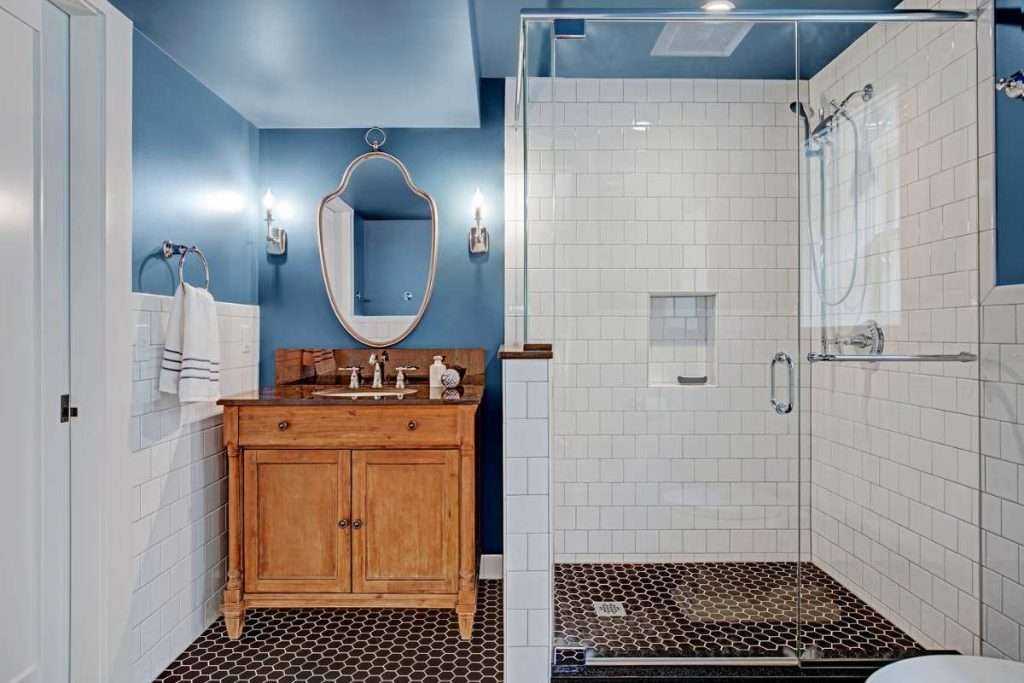 Modern bathroom with blue walls and white shower