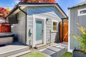 Small modern backyard dwelling with hot tub.