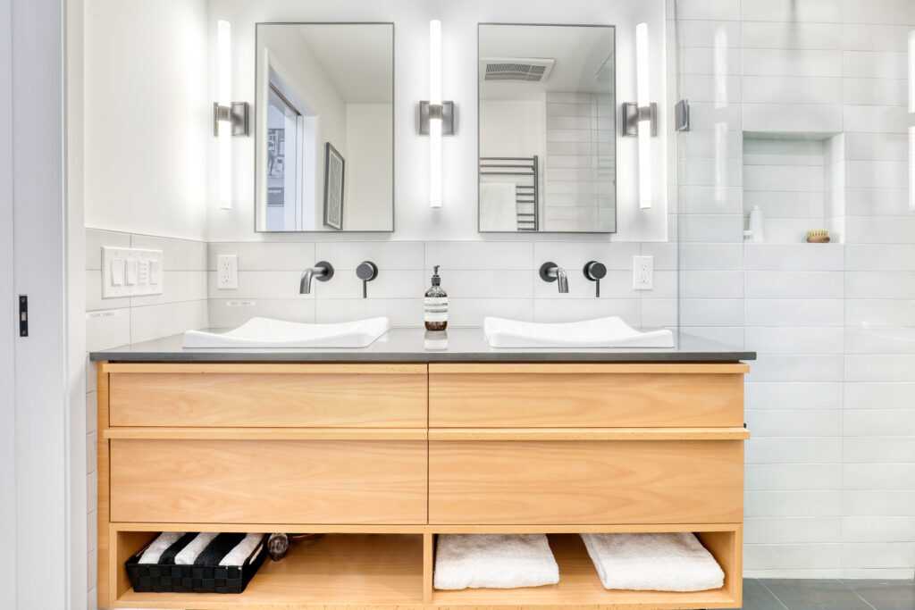Modern bathroom with double vanity and mirrors