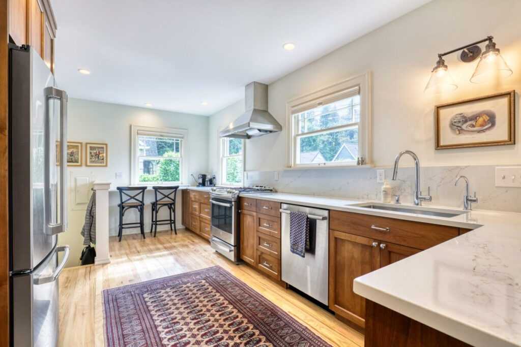 Bright modern kitchen with wooden cabinets and island