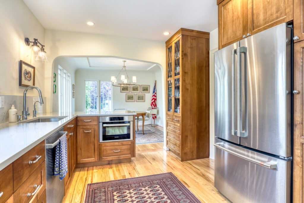Bright modern kitchen with wooden cabinets and stainless appliances