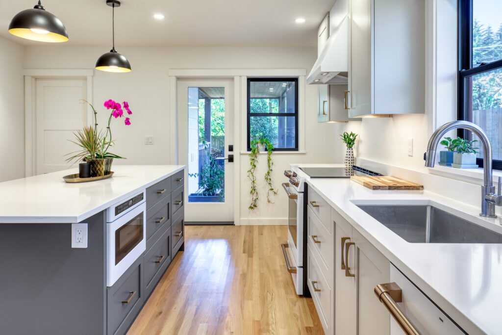 Modern kitchen interior with island and pendant lights