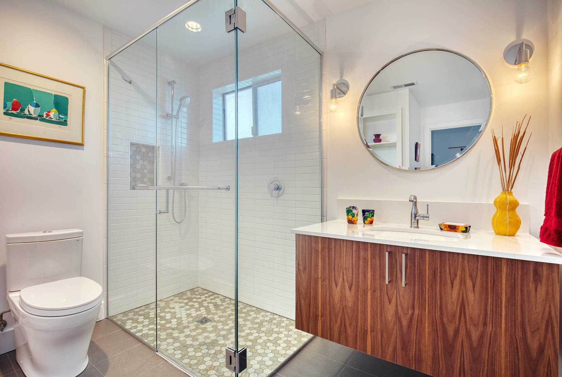 Modern bathroom with glass shower and wooden vanity