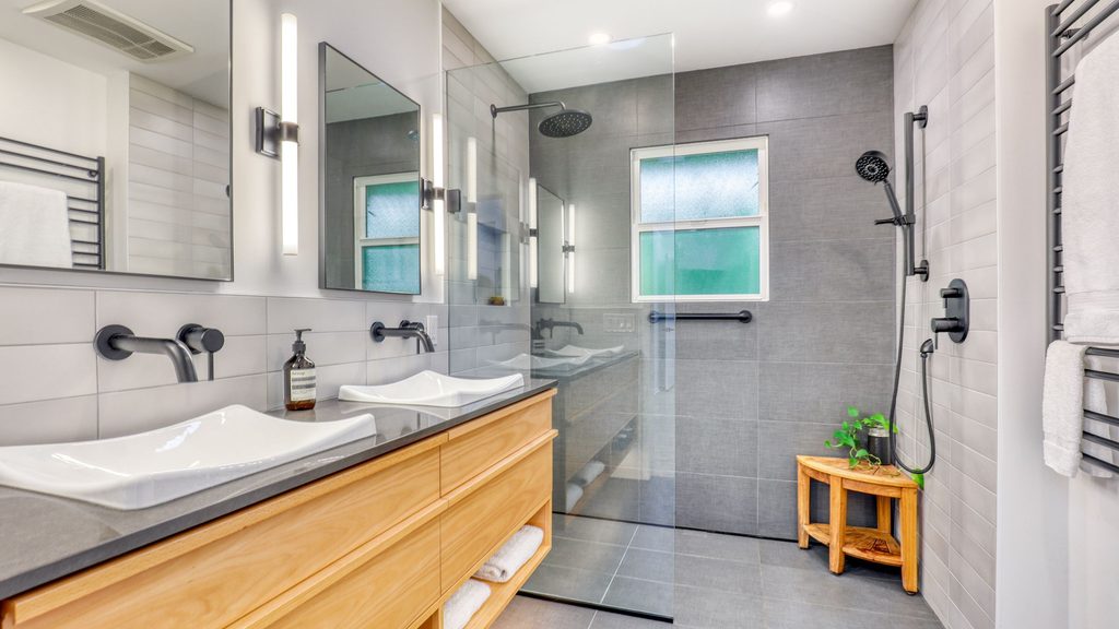 Curbless walk-in shower and double vanity bathroom remodel for a remodeling cost estimate example.